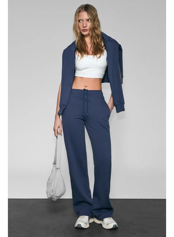 URBAN BEAT CLAYT Women’s Fleece-Lined Soft-Fabric Relaxed Navy Blue Sweatpants with Double Pockets and Print Detailing.