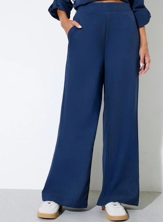 ستايلي Navy Blue Solid Wide Leg Trousers