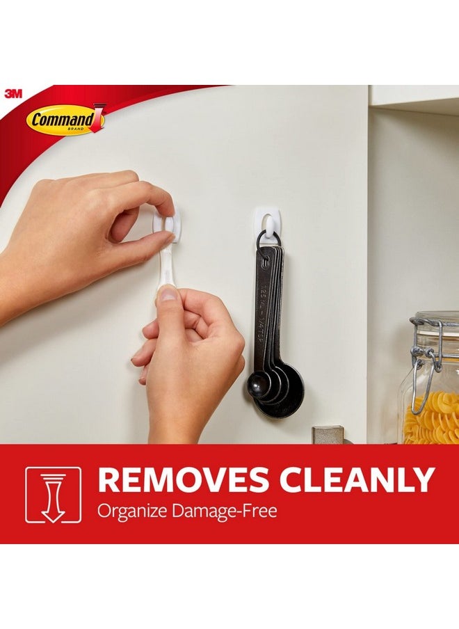 Command Command Damage Free Hanging Light Clips with Adhesive Strips, No Tools Mini Wall Hooks for Hanging Decorations in Living Spaces, 18 White Wall Hooks and 24 Command Strips  - Image 4