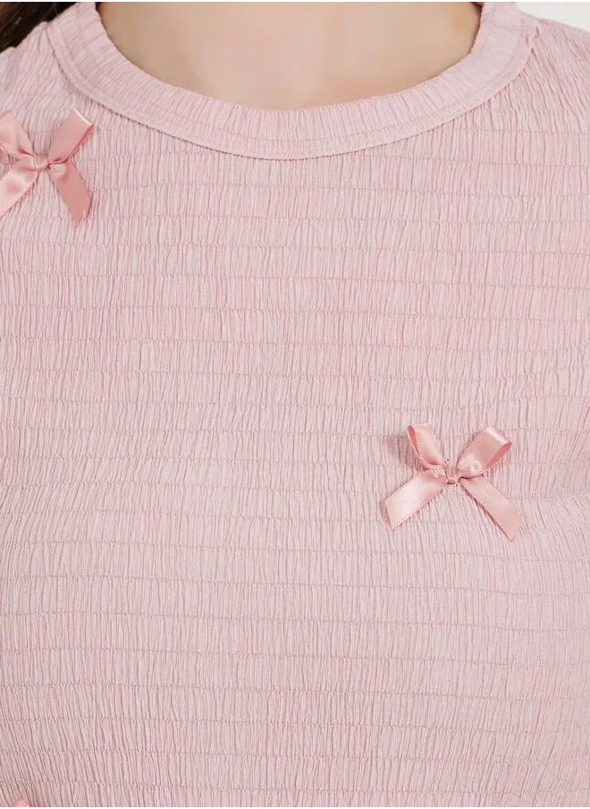 ستايلي Bow Accent Textured Slim Fit Top with Frill Cuff