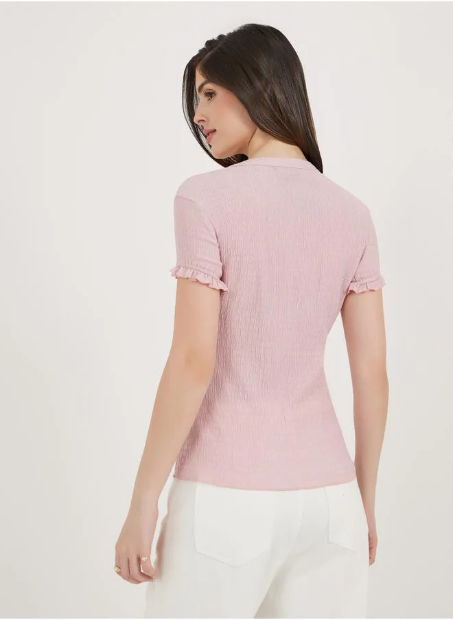 ستايلي Bow Accent Textured Slim Fit Top with Frill Cuff