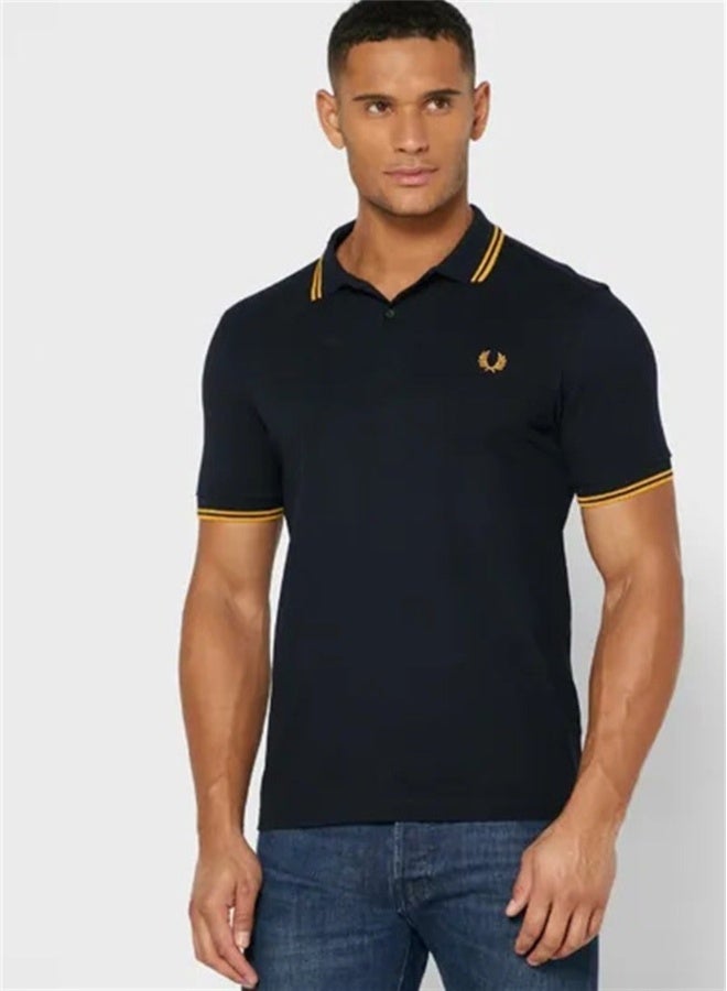 FRED PERRY Men's Classic Fit Twin-Tipped Polo Shirt | 100% Cotton, Embroidered Logo, Machine Washable | Black/Yellow & Yellow Tipping - Image 1