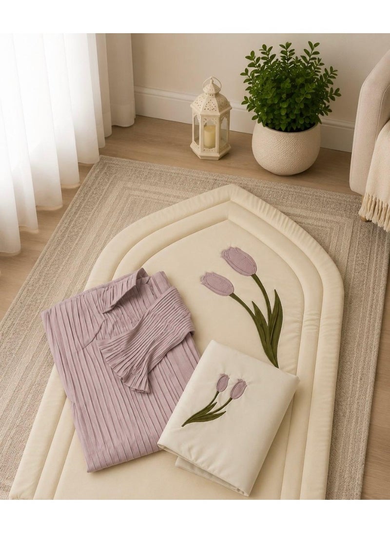 A distinctive Tulip prayer set consisting of a prayer mat with a foam lining in the shape of a mihrab, a plain prayer garment with pleats, and an attached headscarf. One large size for women.
