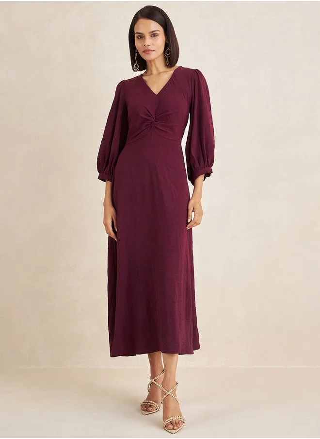 فيميلا Front Twisted Long Sleeves A-Line Maxi Dress by Styli