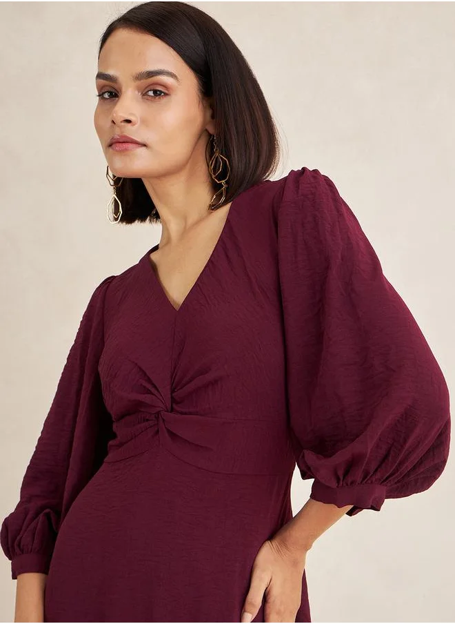 فيميلا Front Twisted Long Sleeves A-Line Maxi Dress by Styli