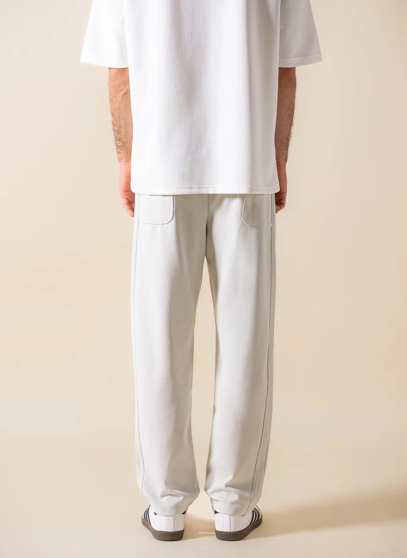 SHAPES TEXTURED JOGGER-WAIST TROUSERS