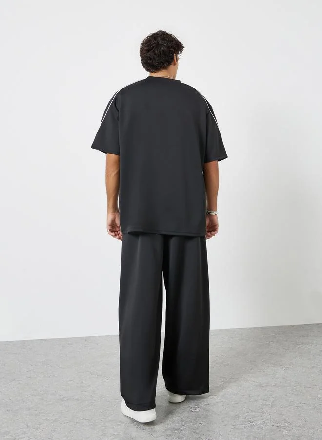 Styli  Men Black Oversized Piping Detail T-Shirt and Pants Co-Ords for Men | Best Price UAE