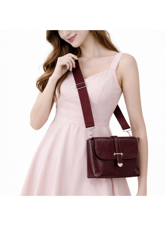 A classic women's crossbody bag crafted from premium genuine leather, featuring a stylish flap design, a distinctive silver metal clasp, and a wide, adjustable strap.