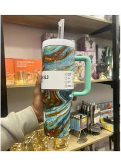 Stanley 1.18L Vacuum Insulated Stainless Steel Thermal Mug. Featuring a stylish marble design and a comfortable mint handle, this mug is perfect for storing water and iced tea. (Green Marble)  - Image 1