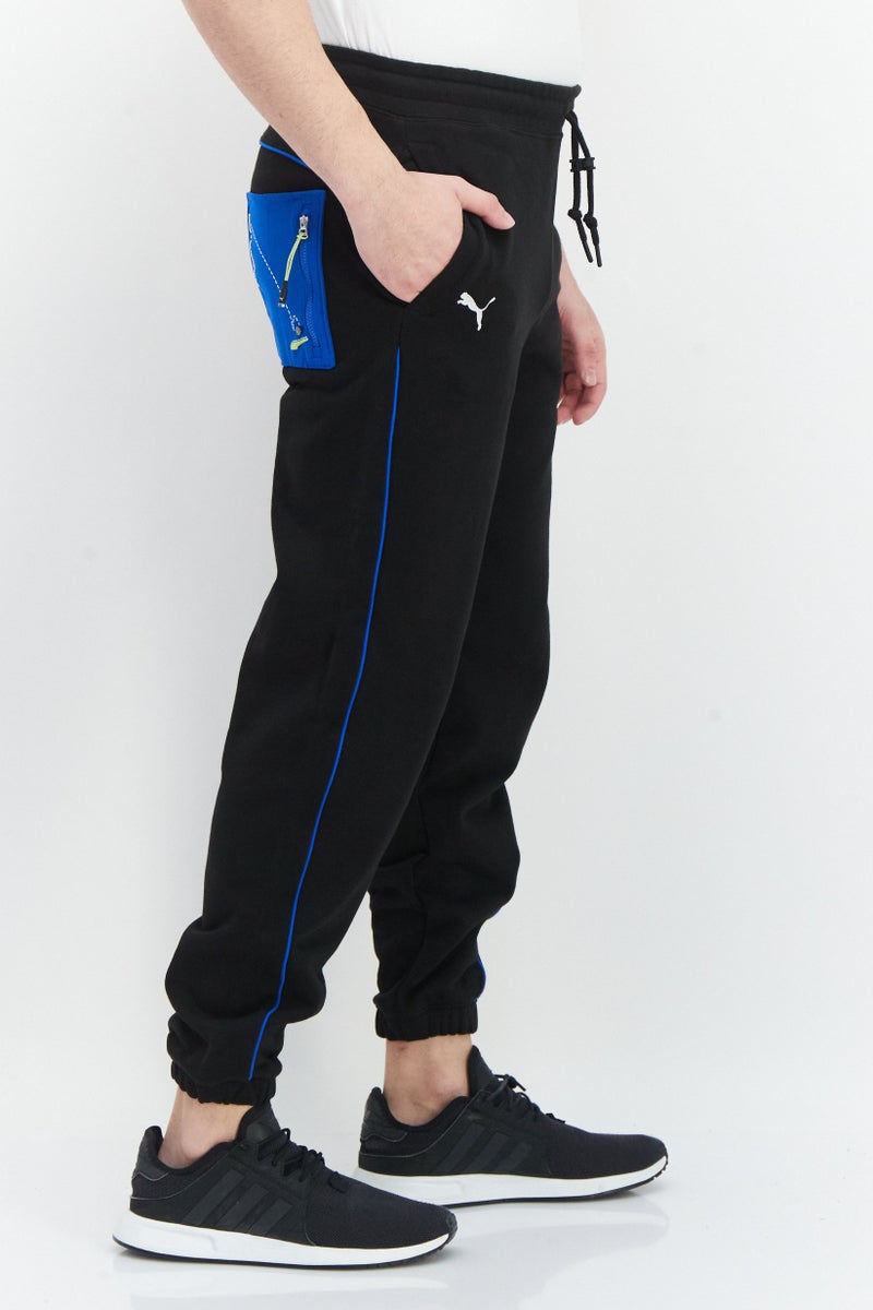 PUMA Roaringwild x Puma Men Sportswear Fit Brand Logo Training Sweatpants, Black - Image 4