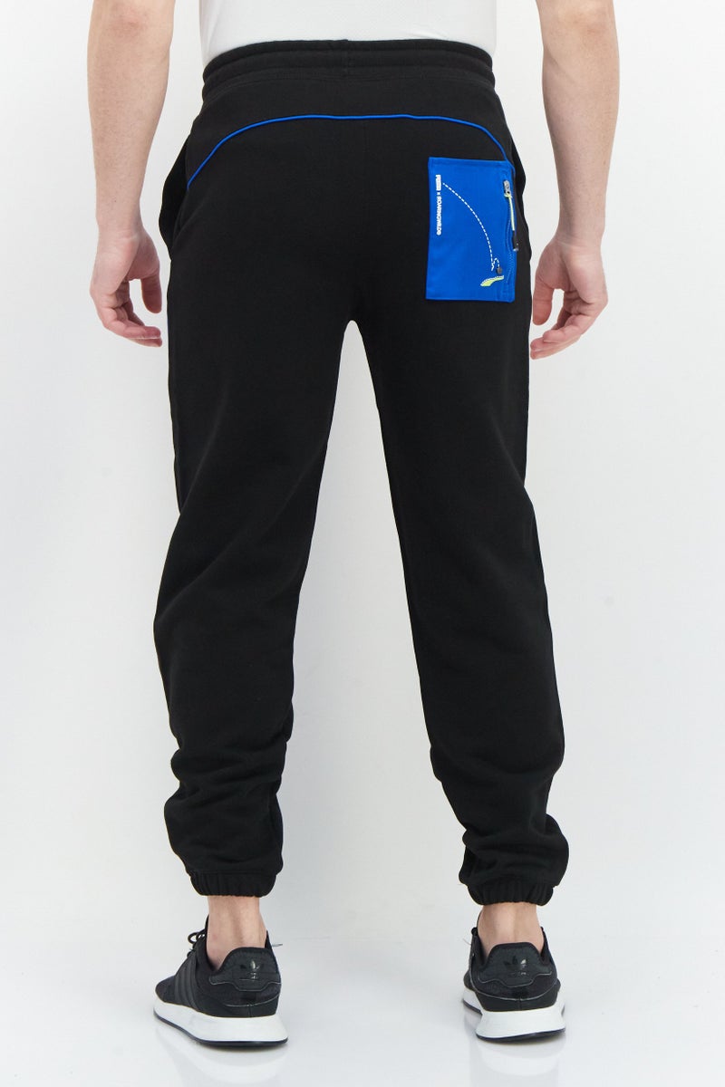 PUMA Roaringwild x Puma Men Sportswear Fit Brand Logo Training Sweatpants, Black - Image 2