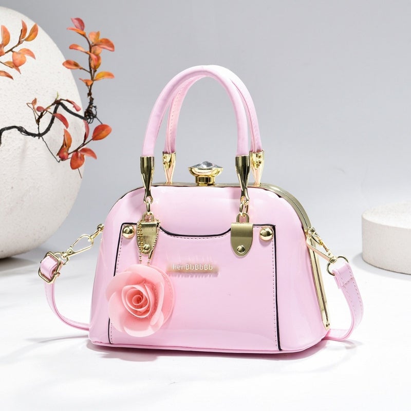 Steel armor mini shell bag, suitable for casual fashion, shiny surface, equipped with floral charm pendant, multi-functional handbag or cross-body bag, fashionable classic, lightweight and durable design