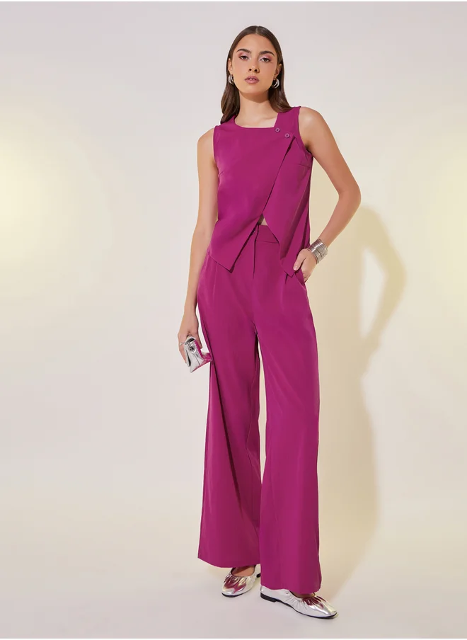 ستايلي Solid Asymmetric Hem Vest Top and Pants Co-Ords