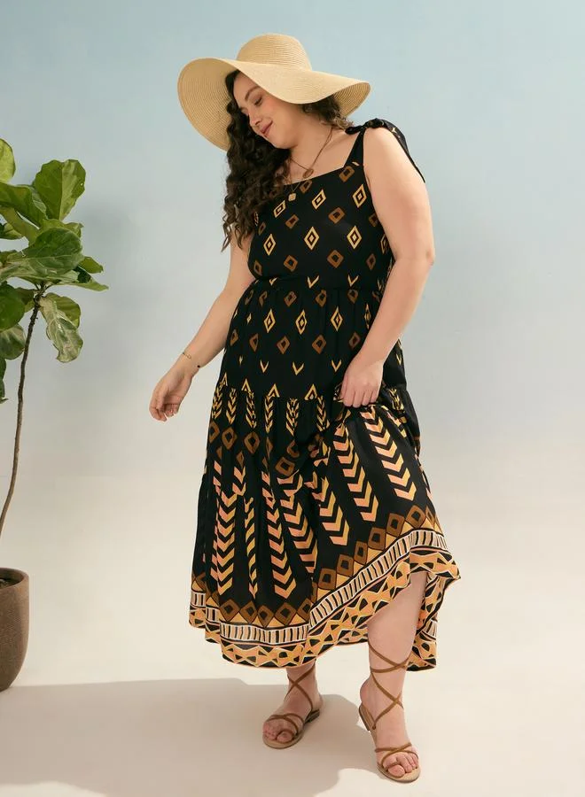 SASSAFRAS Sassafras Plus Black Geometric Tie Up Tiered Maxi Dress