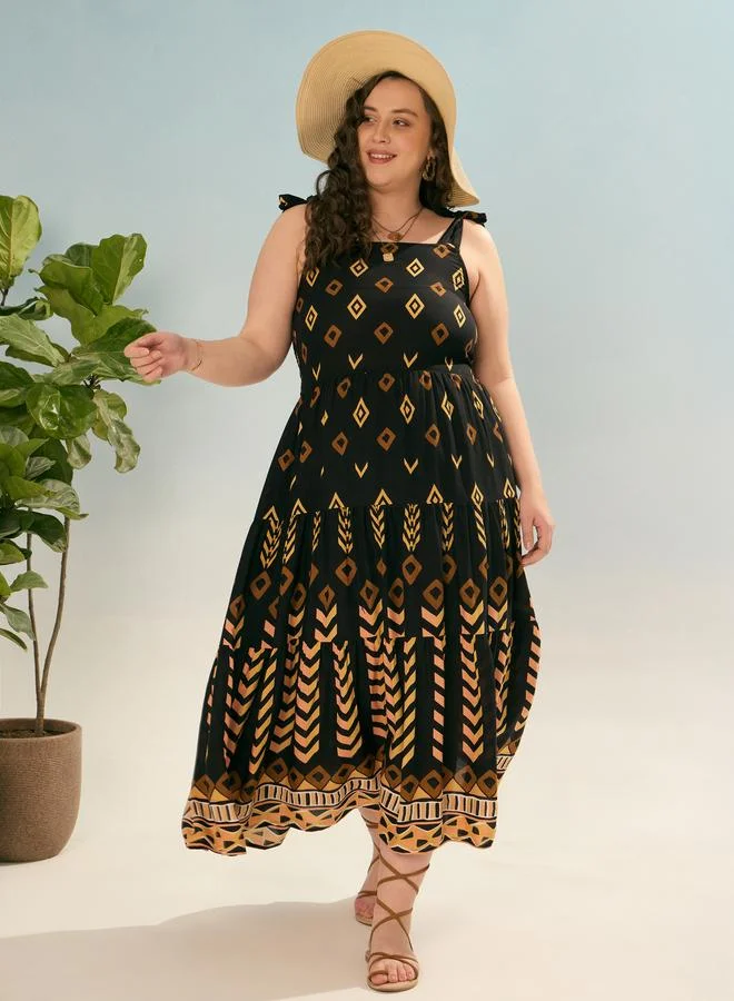 SASSAFRAS Sassafras Plus Black Geometric Tie Up Tiered Maxi Dress