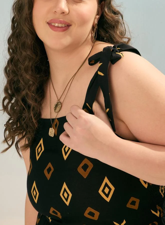 SASSAFRAS Plus Black Geometric Tie Up Tiered Maxi Dress