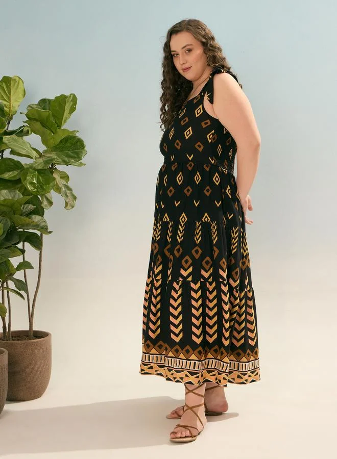 SASSAFRAS Plus Black Geometric Tie Up Tiered Maxi Dress