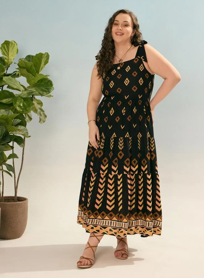 SASSAFRAS Plus Black Geometric Tie Up Tiered Maxi Dress