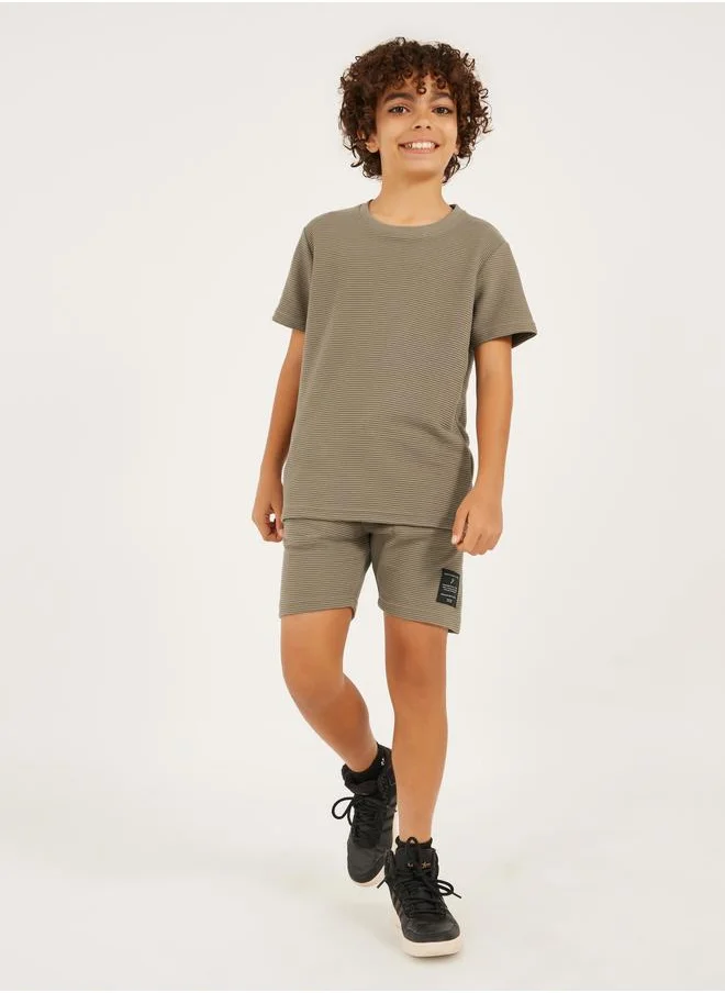 ستايلي Styli Textured T-Shirt Detail and Shorts with Badge Set