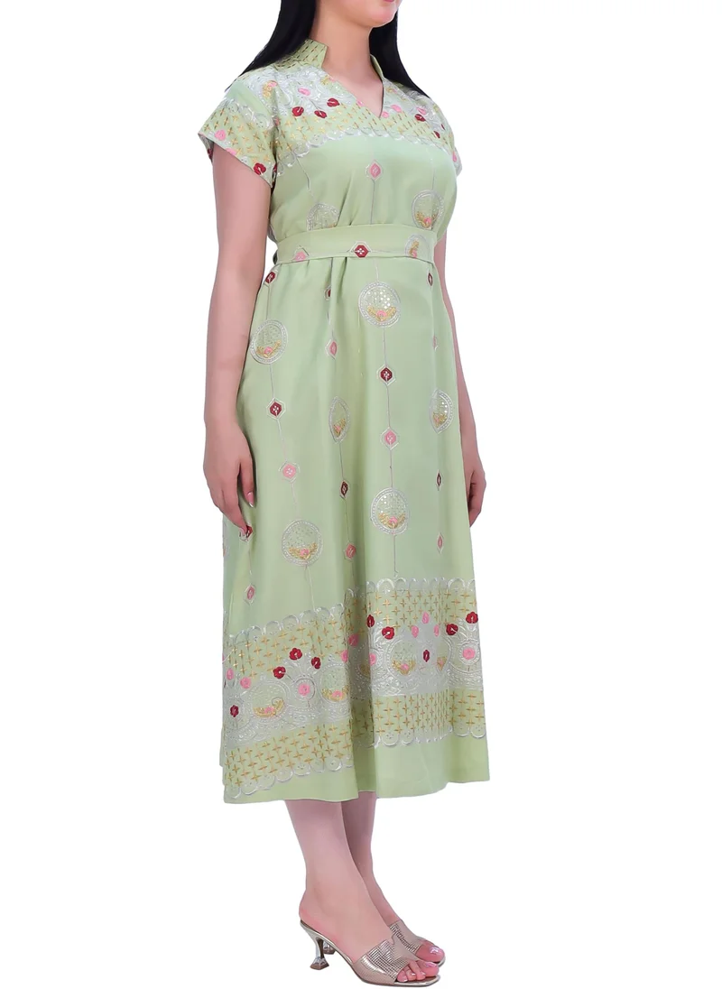 In Love Elegant dress made of lightweight fabric in multiple colors with golden and red embroidery.