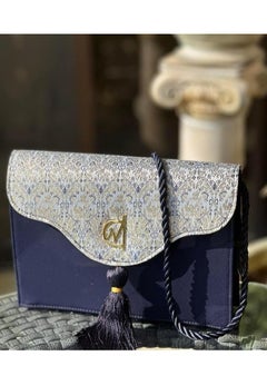 blue and white clutch bag with a tassel