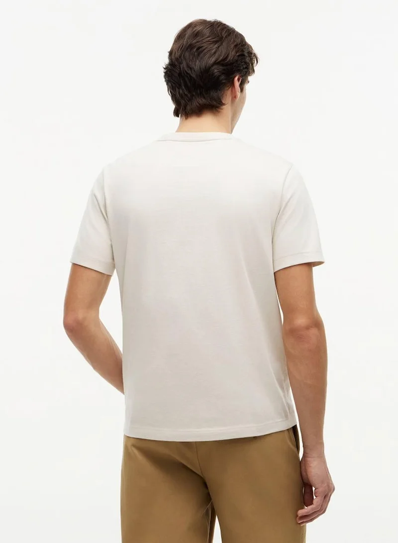 Tommy Hilfiger Newsprint Regular Fit T-Shirt for Men | Best Price UAE