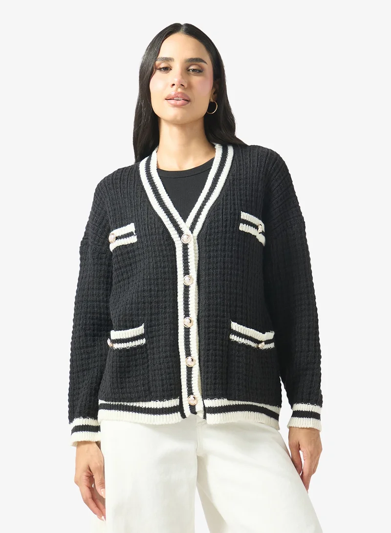 جينجر كارديغان بنمط فارسي وأزرار أمامية مع حواف متباينة