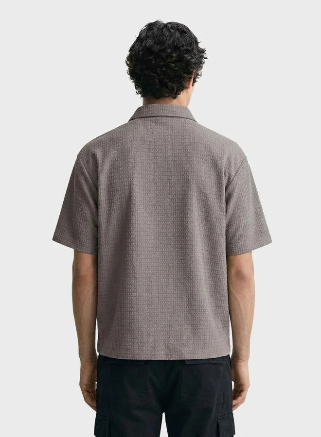 The Indian Garage Co Men Boxy Fit Textured Round Neck Half Sleeves Polo T-Shirt