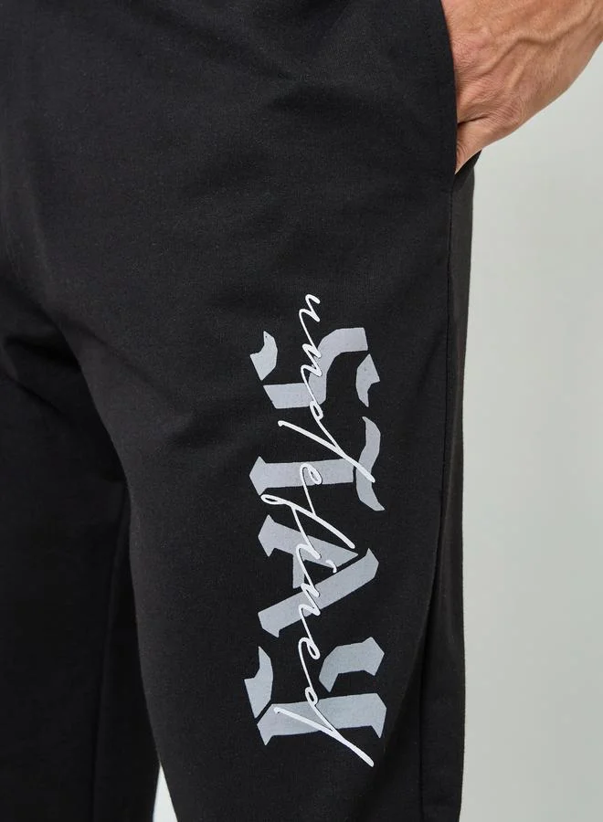 Styli  Men Black Graphic Print Relaxed Joggers for Men | Best Price UAE