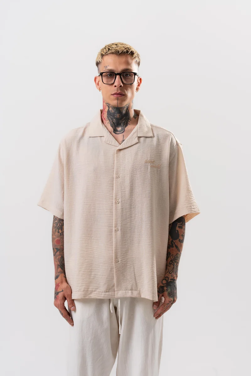 ريسباير قميص رجالي واسع (Oversize) مطرز بنجمة (Star) لون بيج