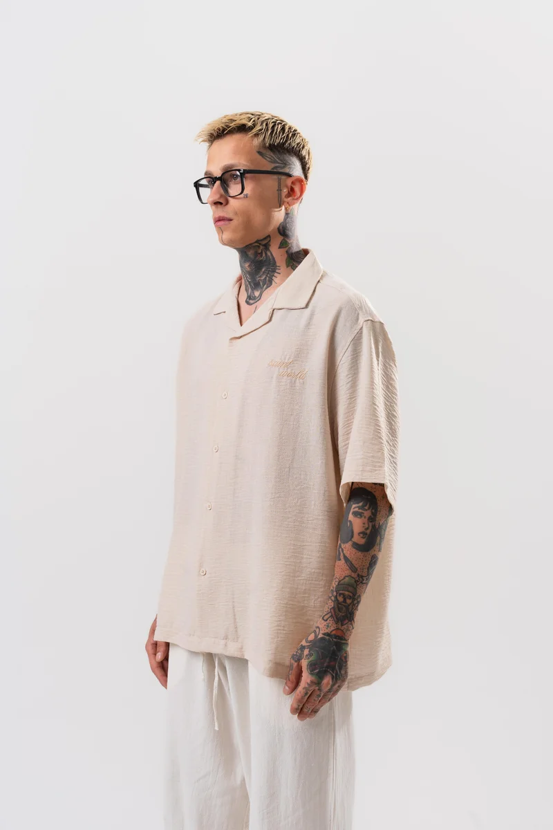 ريسباير قميص رجالي واسع (Oversize) مطرز بنجمة (Star) لون بيج