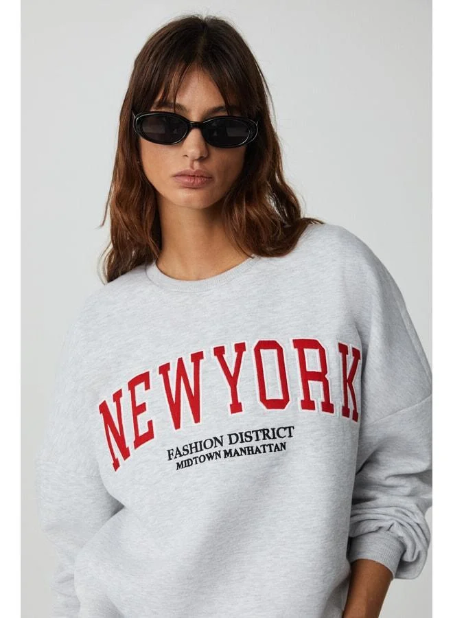 Ethiquet JORDAN Women's Long Sleeve Round Neck Front Appliqué Embroidered Low Shoulder Oversize Grimelanj Sweatshirt.