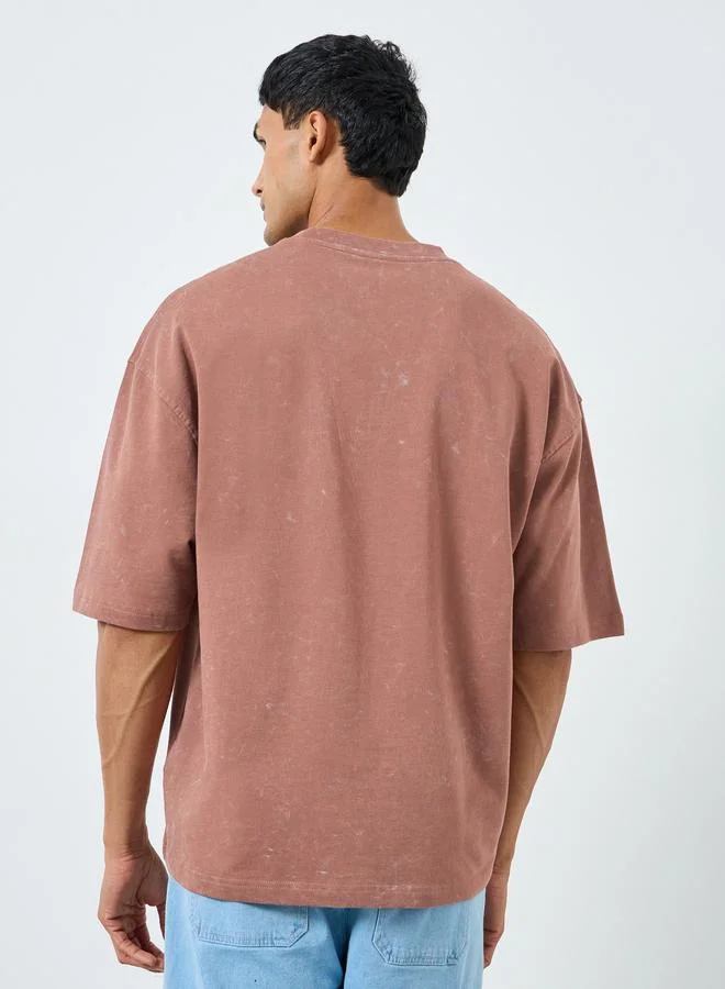 Styli orange Men Boxy Fit Acid Wash Printed T-Shirt for Men | Best Price UAE