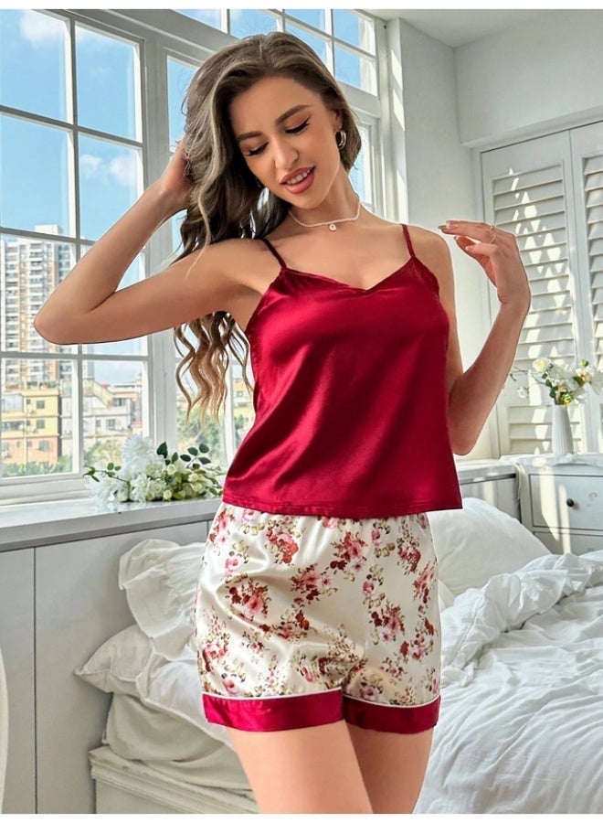 Pajama set consisting of a solid satin cami top and floral-print shorts. - Image 1