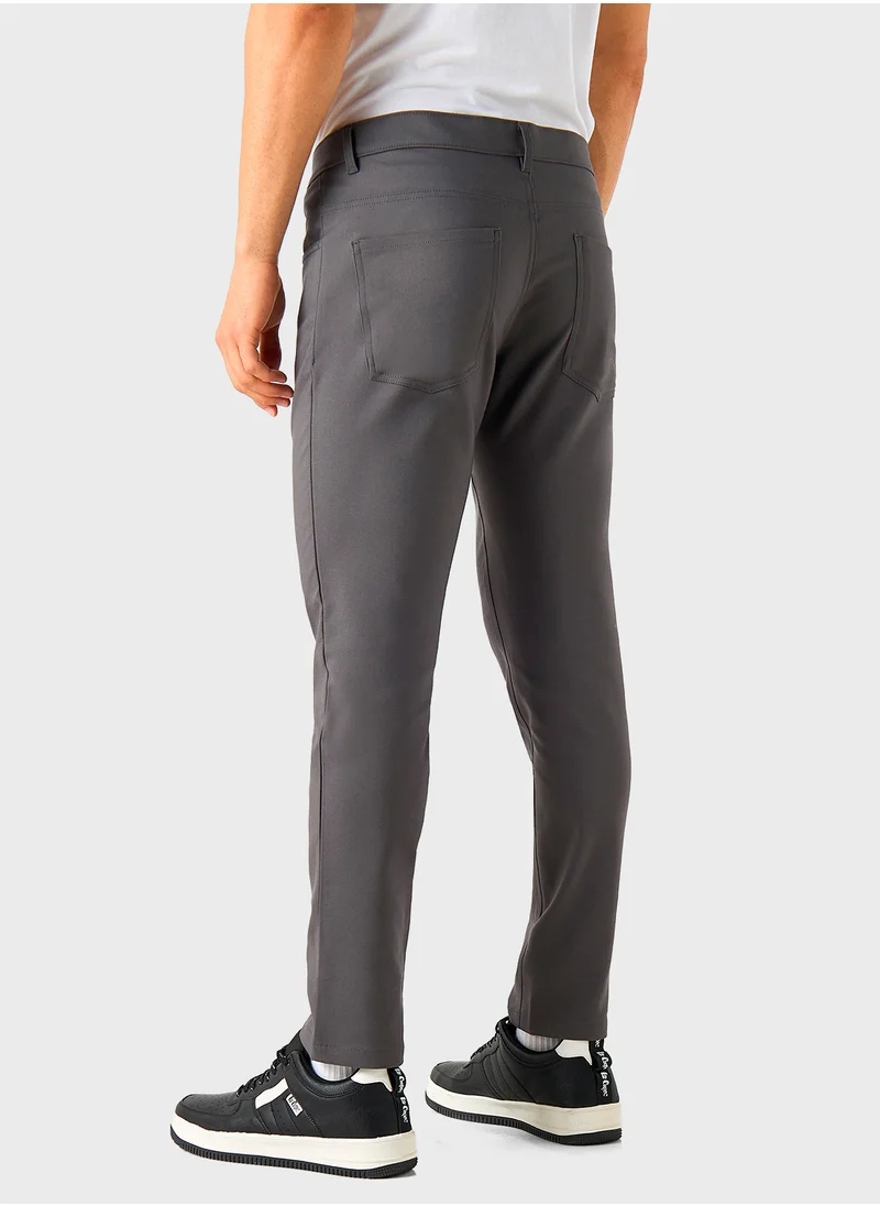 ايكونيك Iconic Solid Slim Fit Pants with Pockets