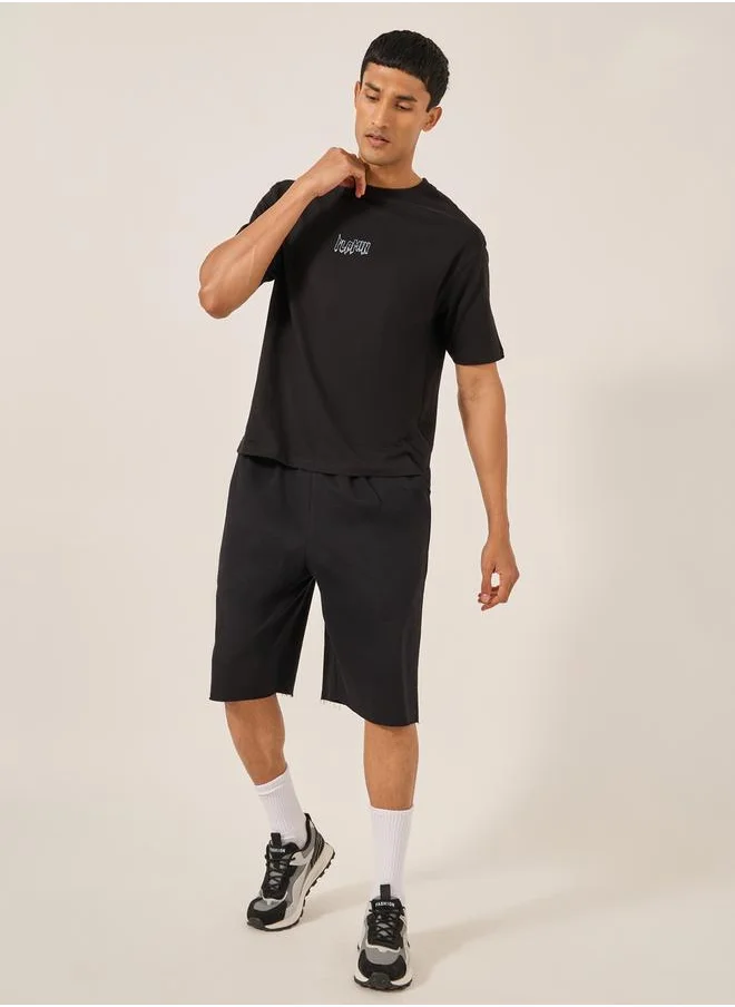 Styli Solid Raw Edge Hem Terry Oversized Shorts