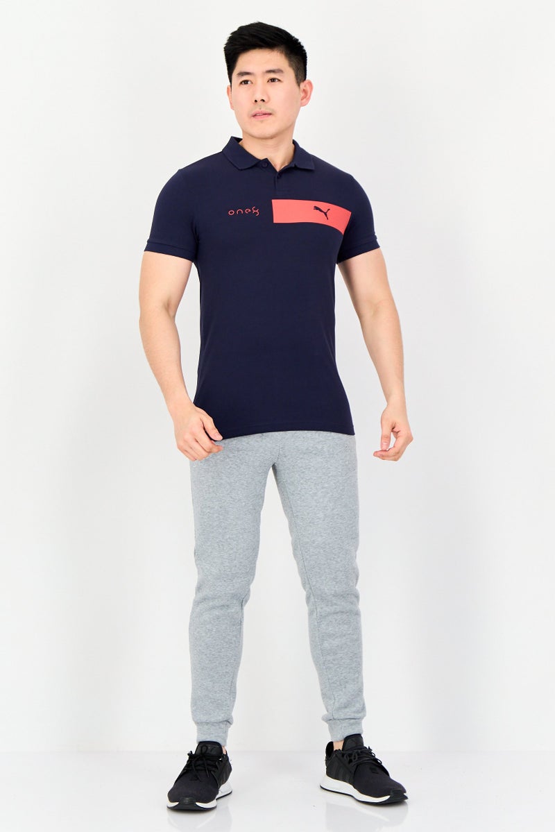 PUMA قميص بولو قصير الأكمام للرجال من One8 بتصميم ضيق مع شعار العلامة التجارية، أزرق داكن - Image 2