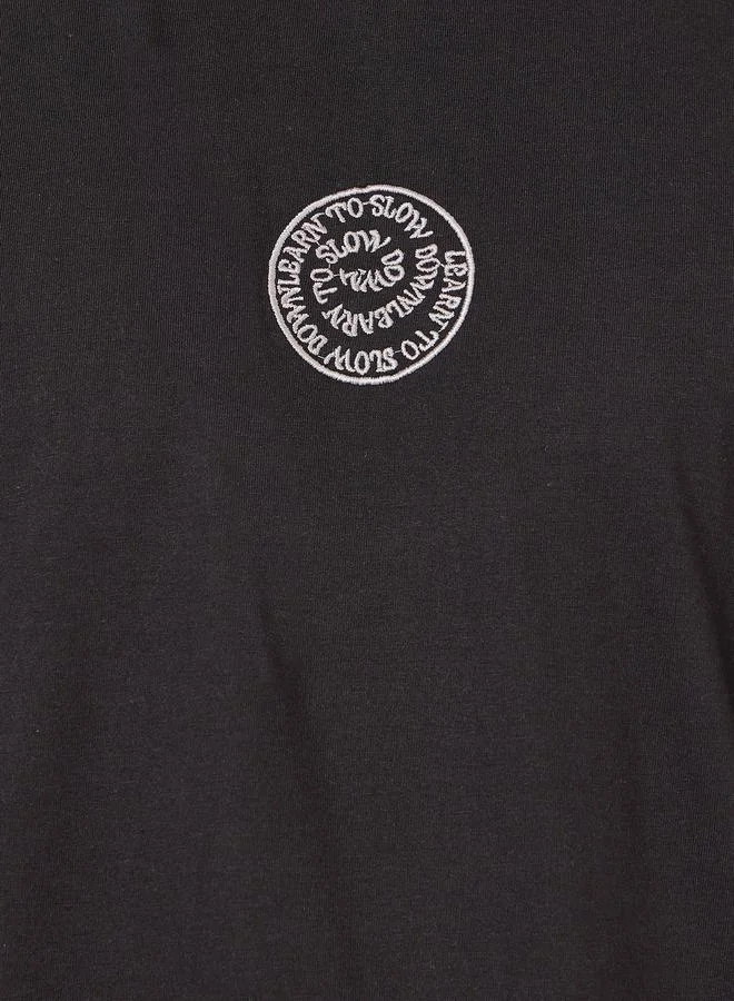 ستايلي Back Printed Oversized Cotton Rich T-Shirt with Mock Neck Detail