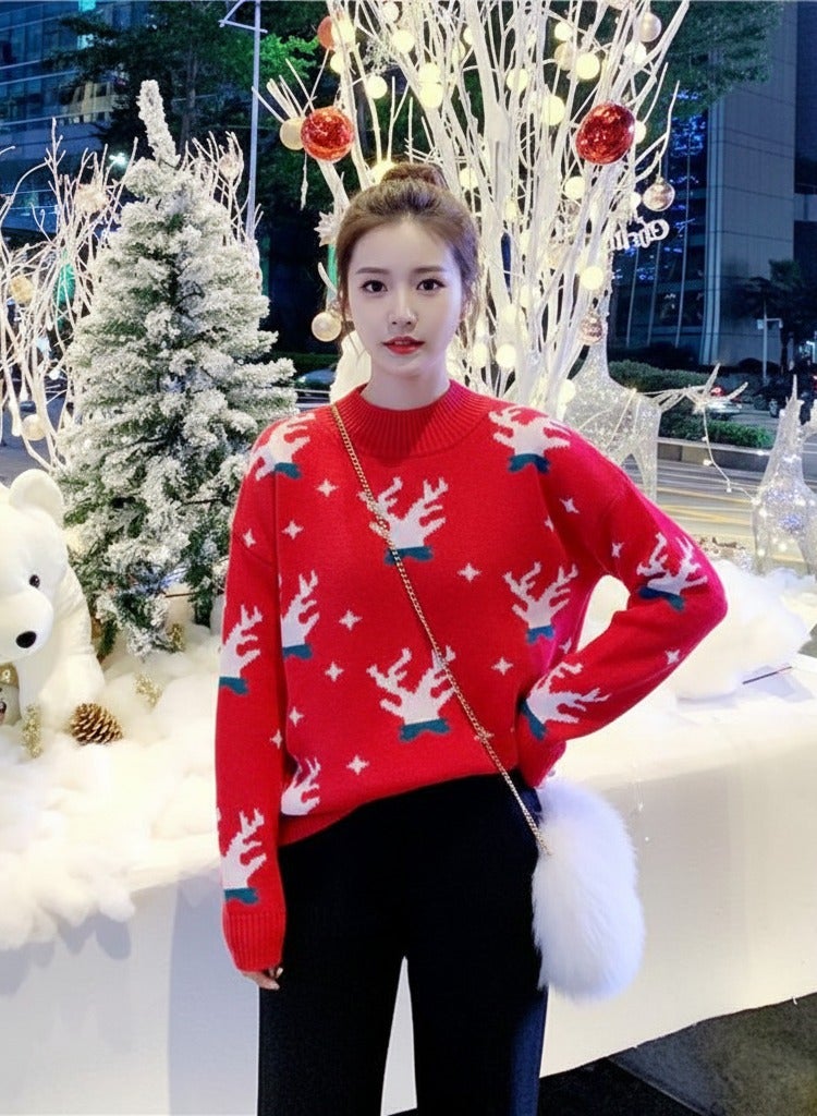A.M festive Christmas outfit, centered around a vibrant red pullover sweater with a white reindeer and snowflake pattern - Image 1