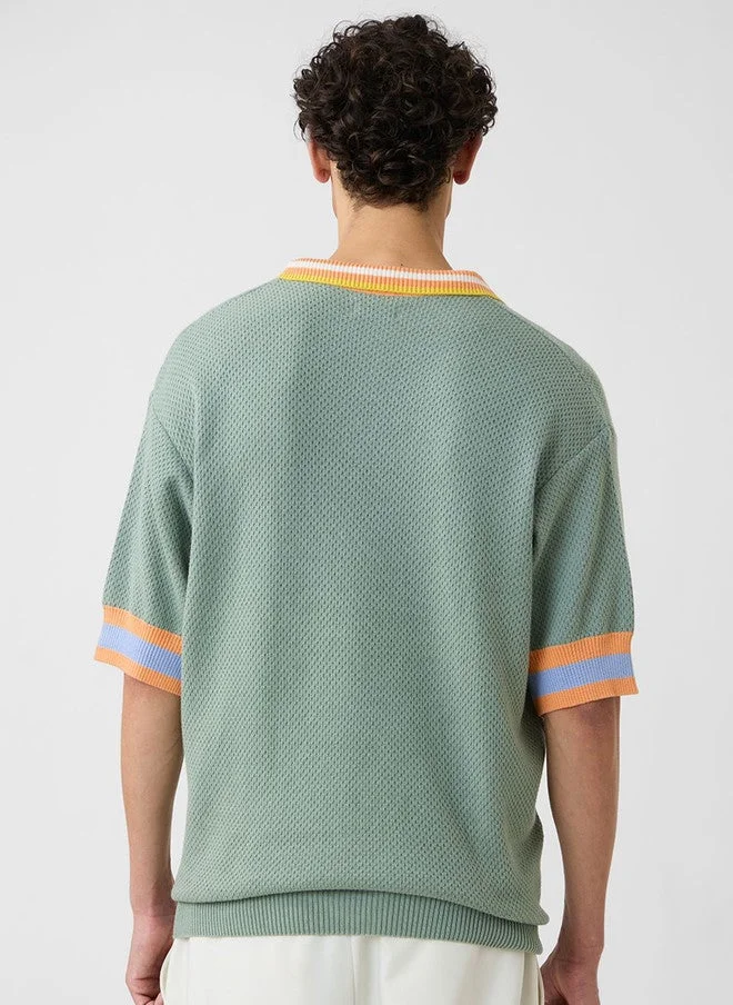 The Souled Store  The Souled Store Men's Oversized Green Polo T-Shirt with Drop-Shoulder Sleeves  | Best Price UAE