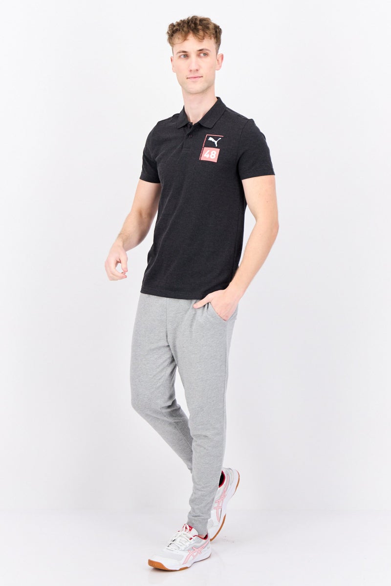 PUMA قميص بولو خارجي للرجال بقصة ضيقة بأكمام قصيرة، أسود - Image 4