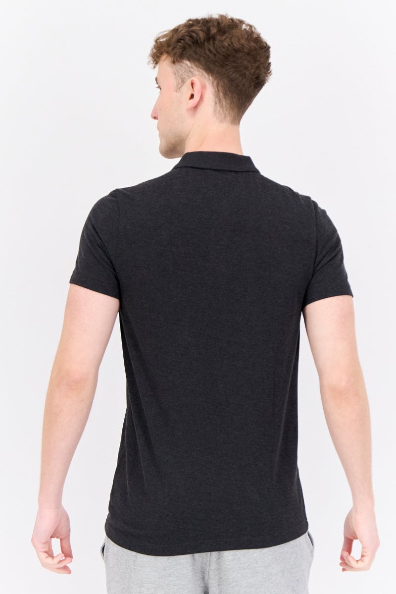 PUMA قميص بولو خارجي للرجال بقصة ضيقة بأكمام قصيرة، أسود - Image 3