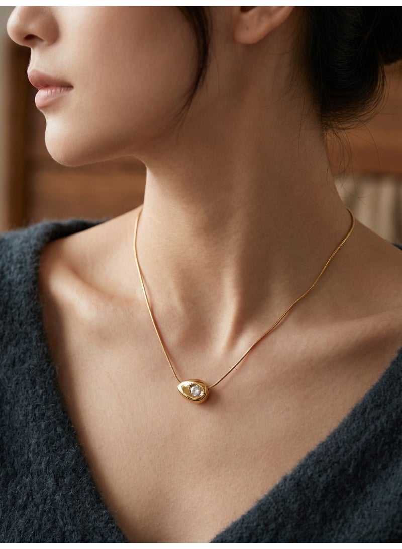 A sophisticated necklace crafted from pure gold-toned stainless steel, featuring a sleek design that perfectly balances modern minimalism with timeless elegance