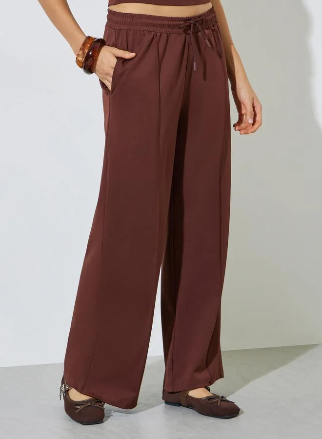 ستايلي Brown Scuba Wide Leg Joggers With Piping Detail