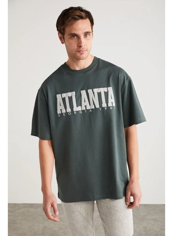 GRIMELANGE ATLANTA Men's 100% Cotton Short Sleeve Green T-Shirt with Printed Details.
