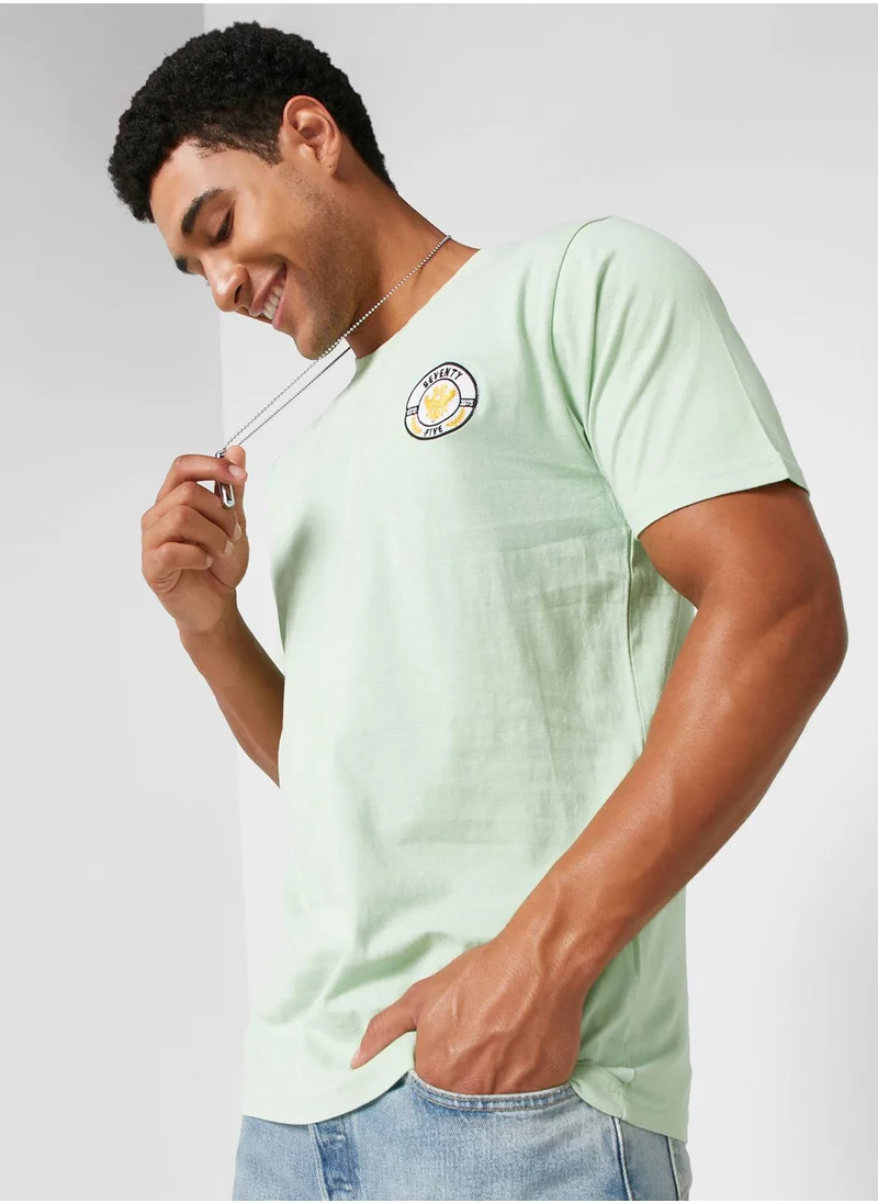 سفنتي فايف Badge T Shirt