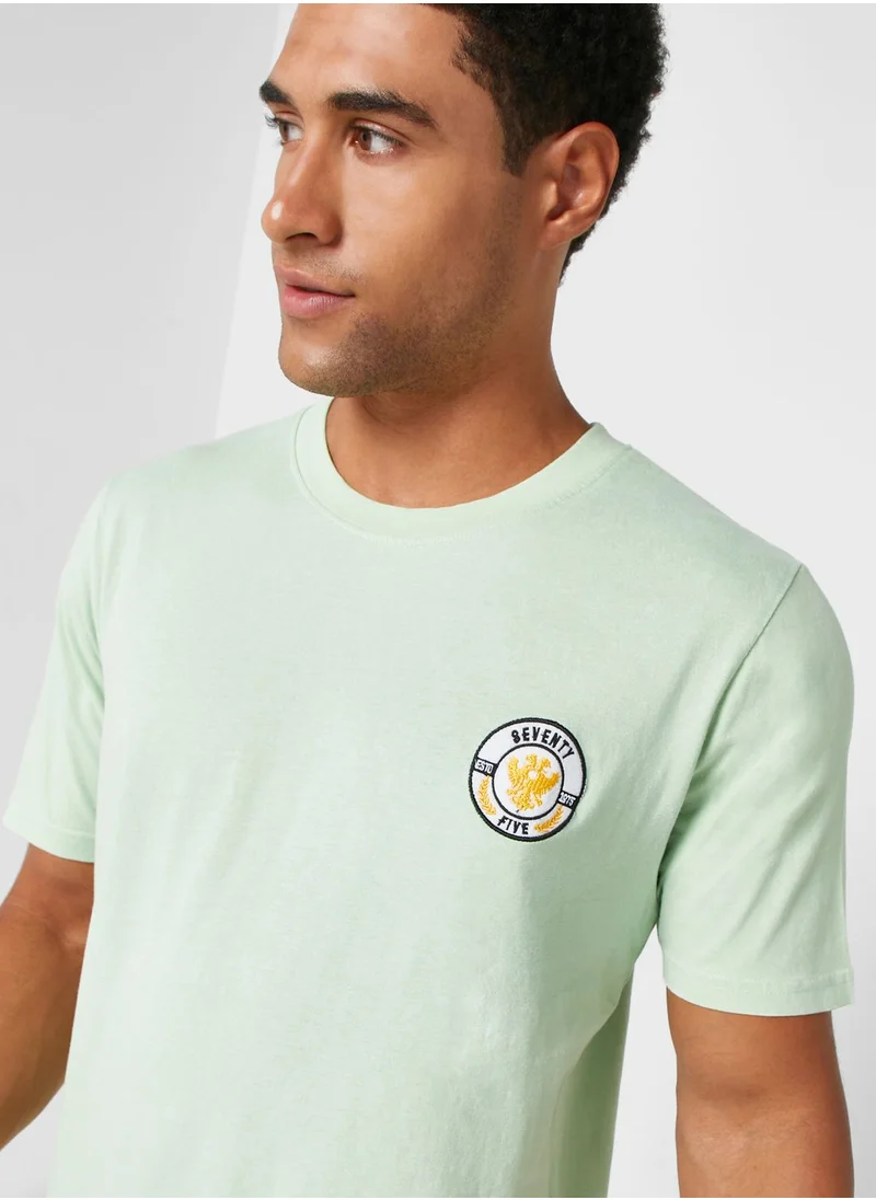 سفنتي فايف Badge T Shirt