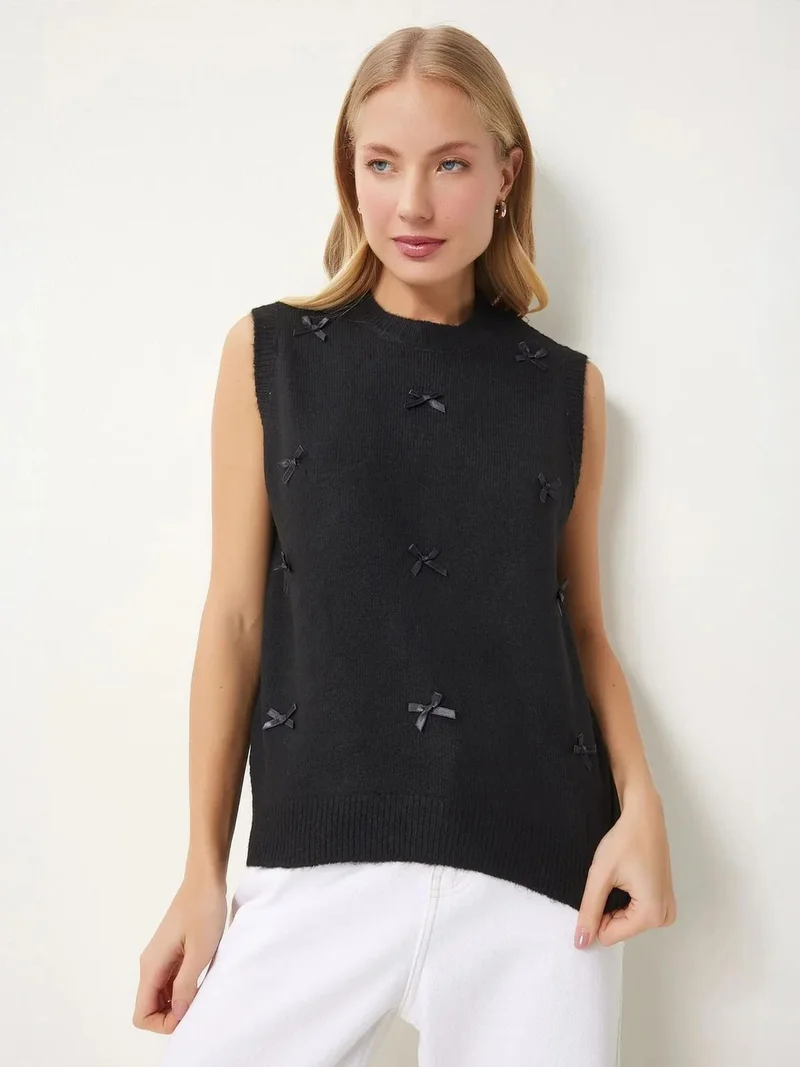 Lovely Istanbul ISTANBUL Textured Knit Sweater Vest with Bow Detail
