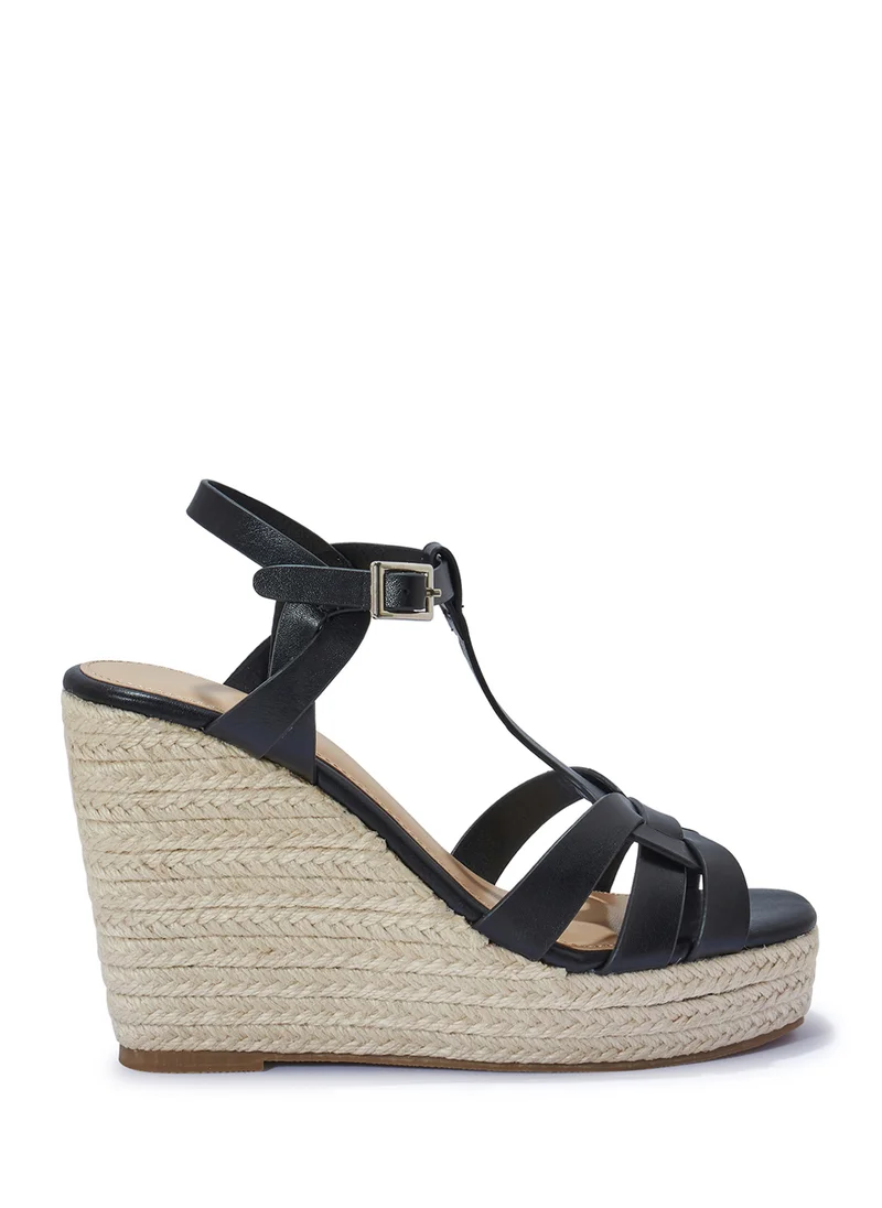 ترافل من نمشي High Heel Ankle Strap Wedge Sandal