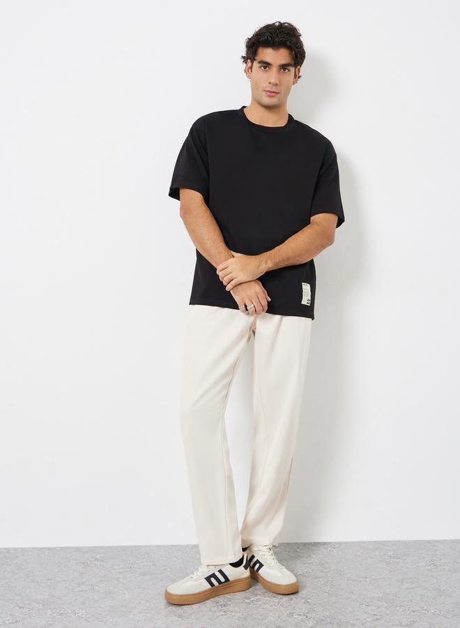 ستايلي تيشيرت جيرسي واسع مزين بشارة - Image 2